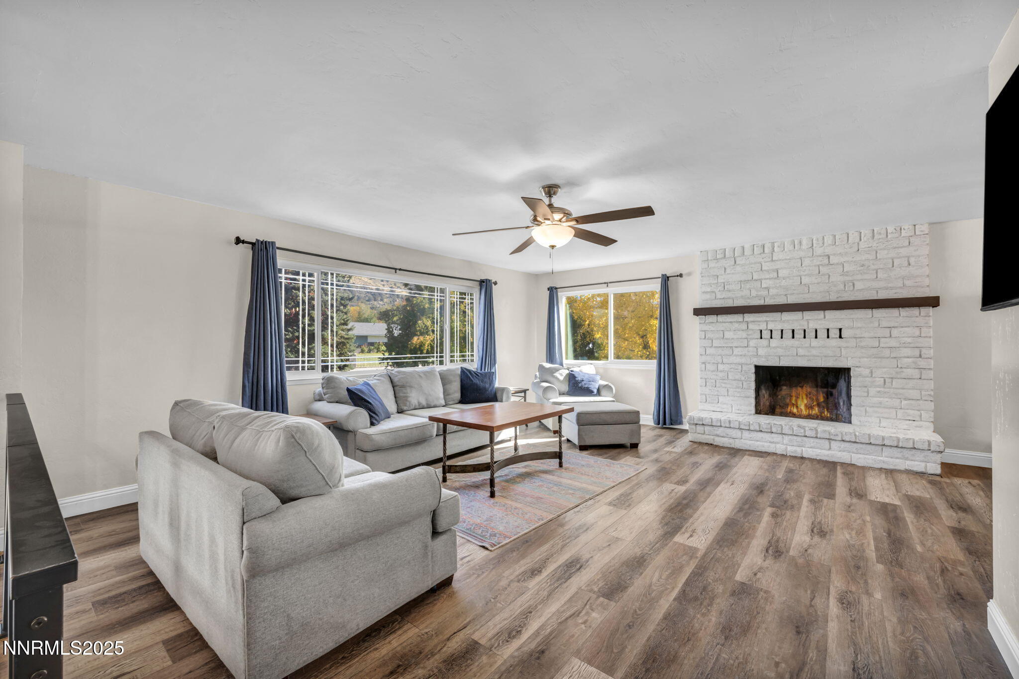 14595 Chamy Drive Reno, NV 89521 - Photo 4 of 66 a living room with furniture and a fireplace