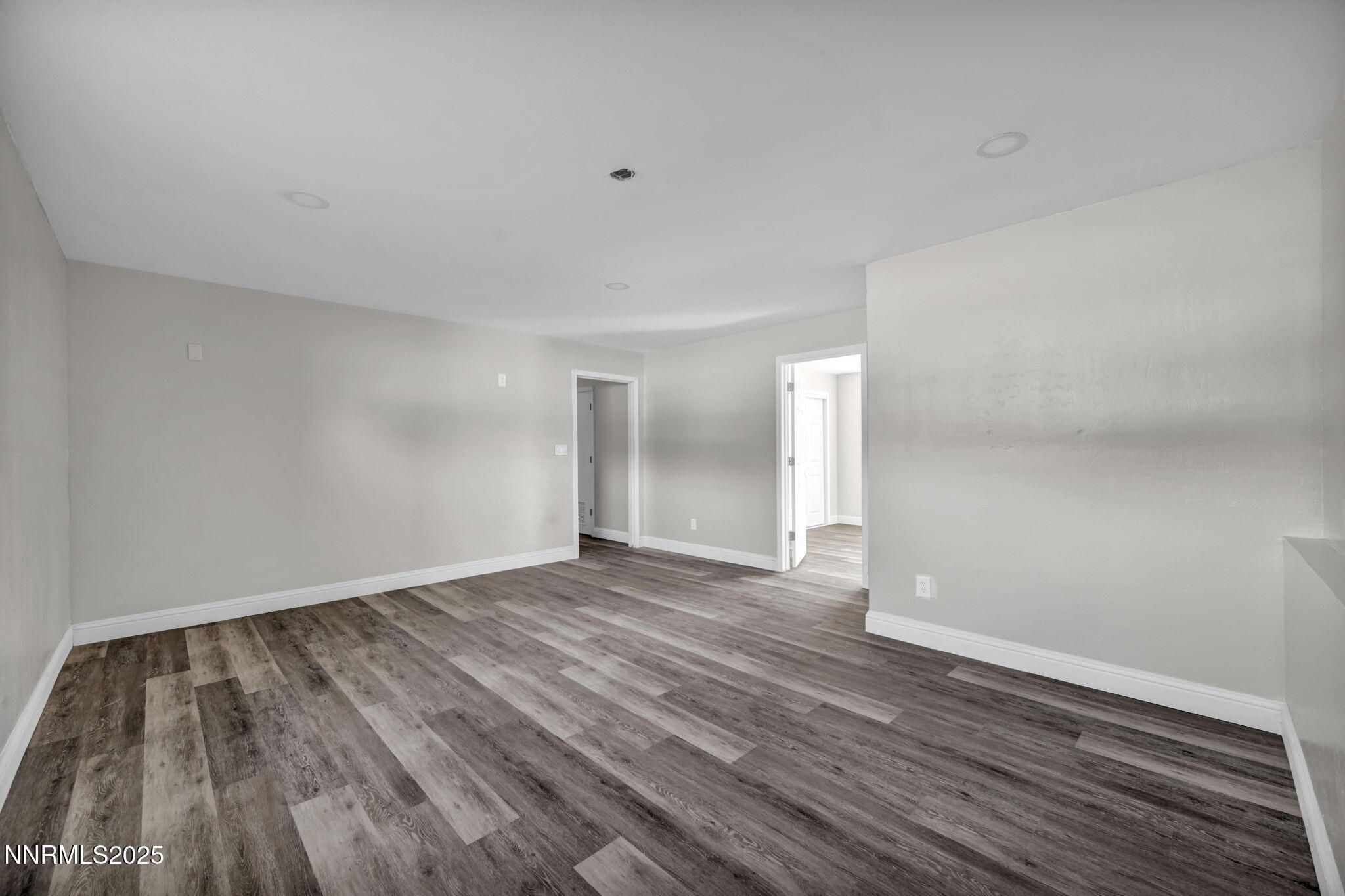 14595 Chamy Drive Reno, NV 89521 - Photo 41 of 66 a view of an empty room and wooden floor