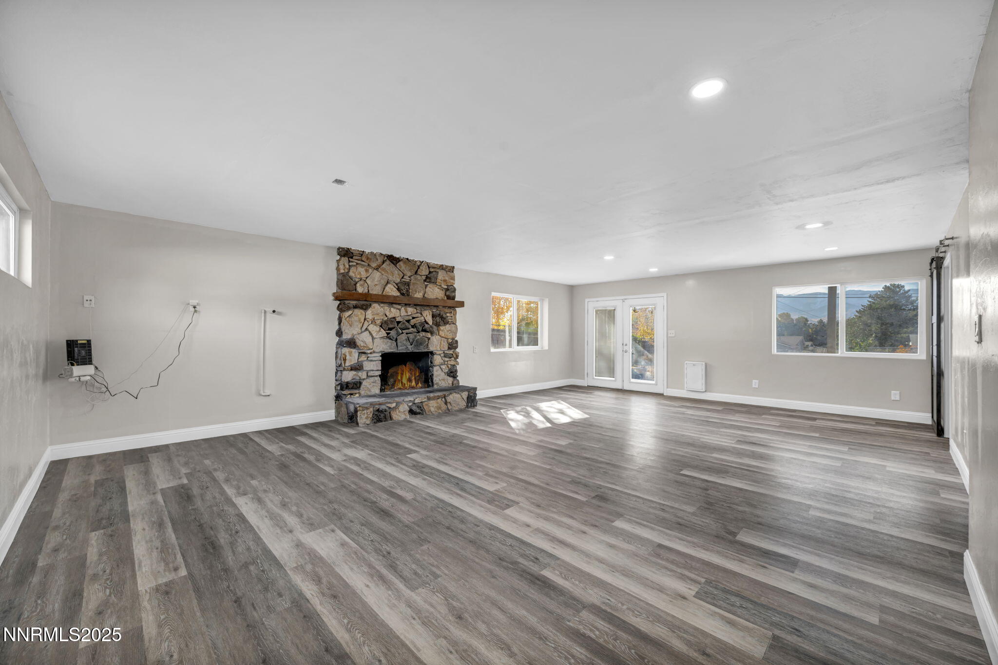 14595 Chamy Drive Reno, NV 89521 - Photo 45 of 66 a view of empty room with wooden floor and window