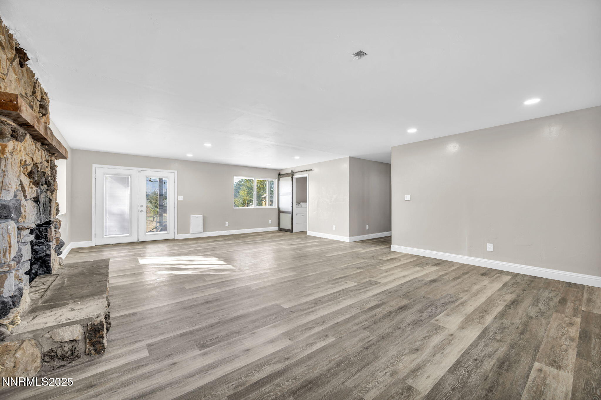 14595 Chamy Drive Reno, NV 89521 - Photo 47 of 66 a view of an empty room with wooden floor and a window