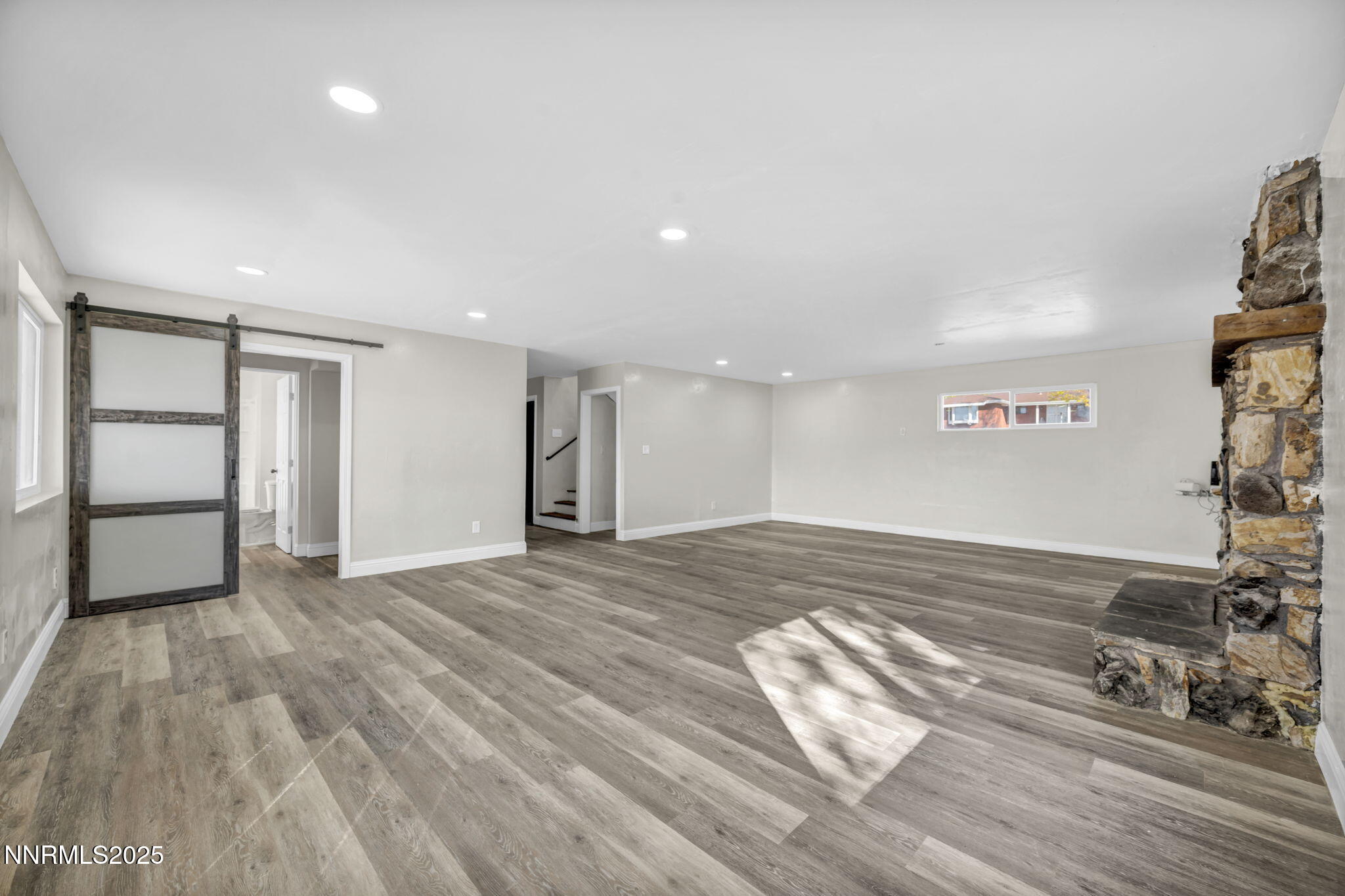 14595 Chamy Drive Reno, NV 89521 - Photo 48 of 66 a view of empty room with wooden floor and window