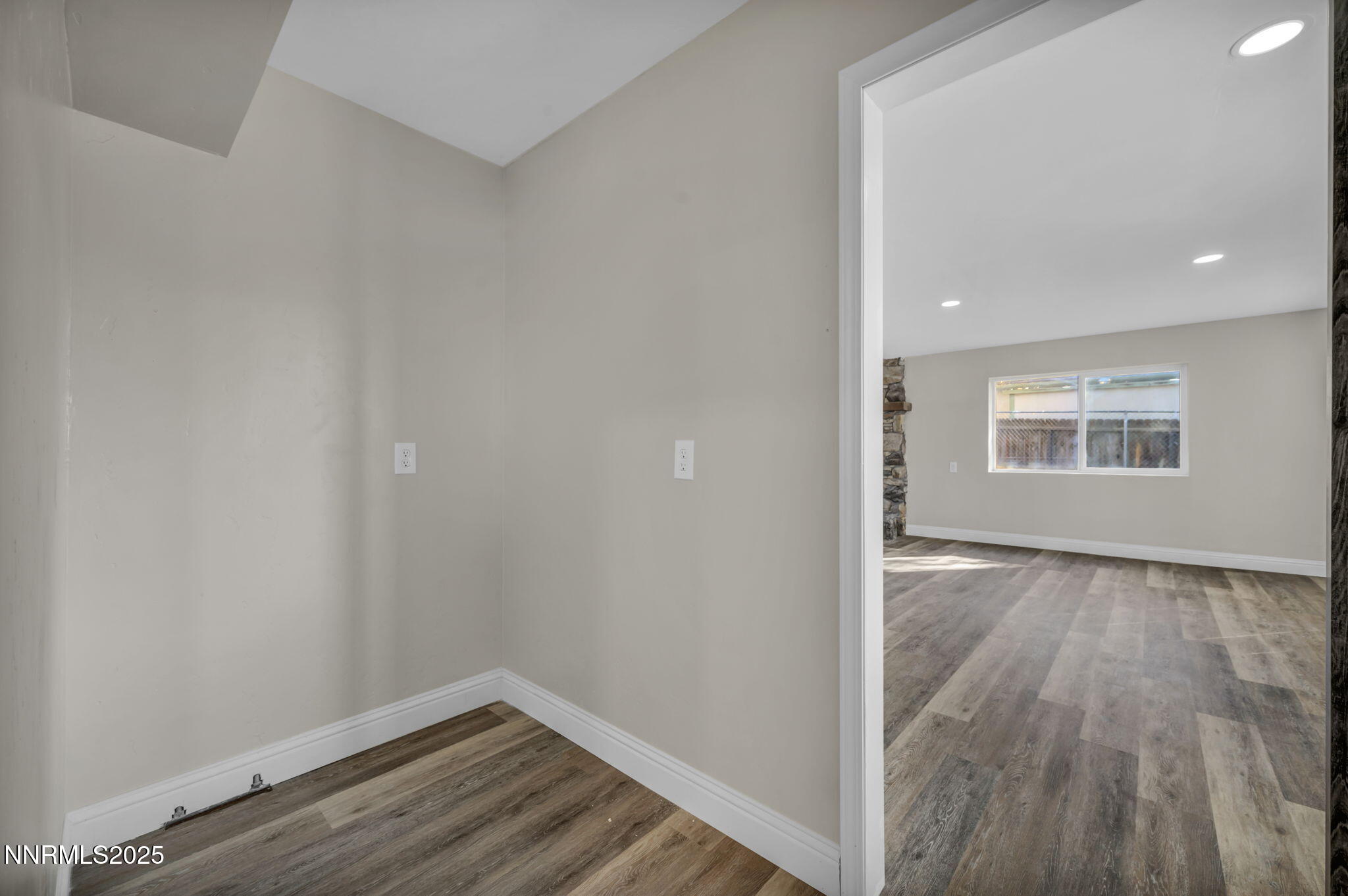 14595 Chamy Drive Reno, NV 89521 - Photo 53 of 66 a view of an empty room with wooden floor and a window