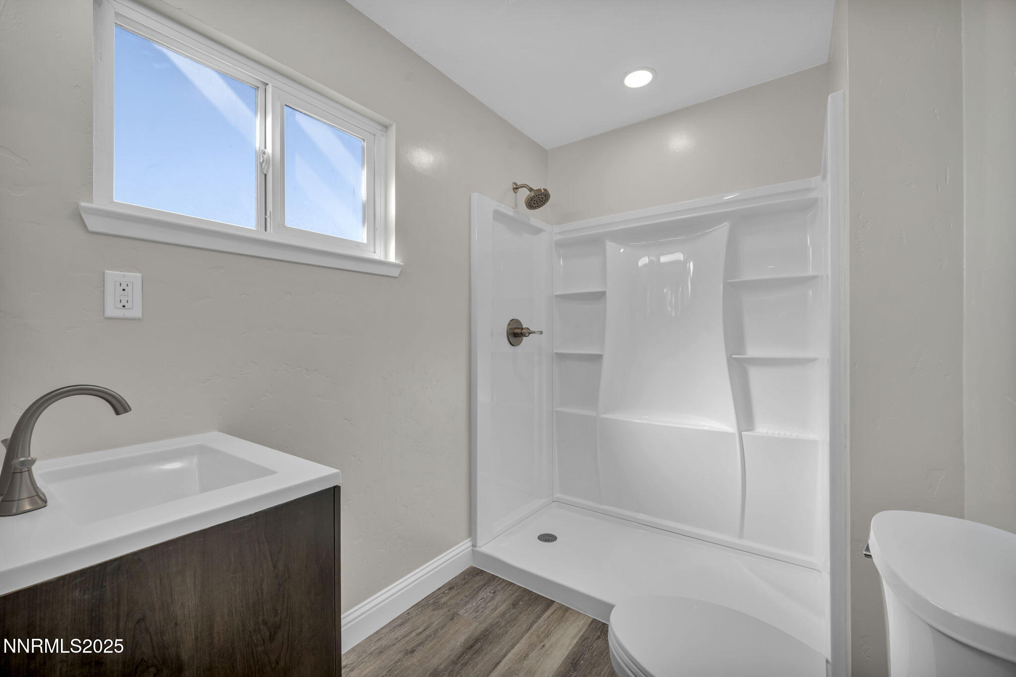 14595 Chamy Drive Reno, NV 89521 - Photo 57 of 66 a bathroom with a shower sink vanity and toilet