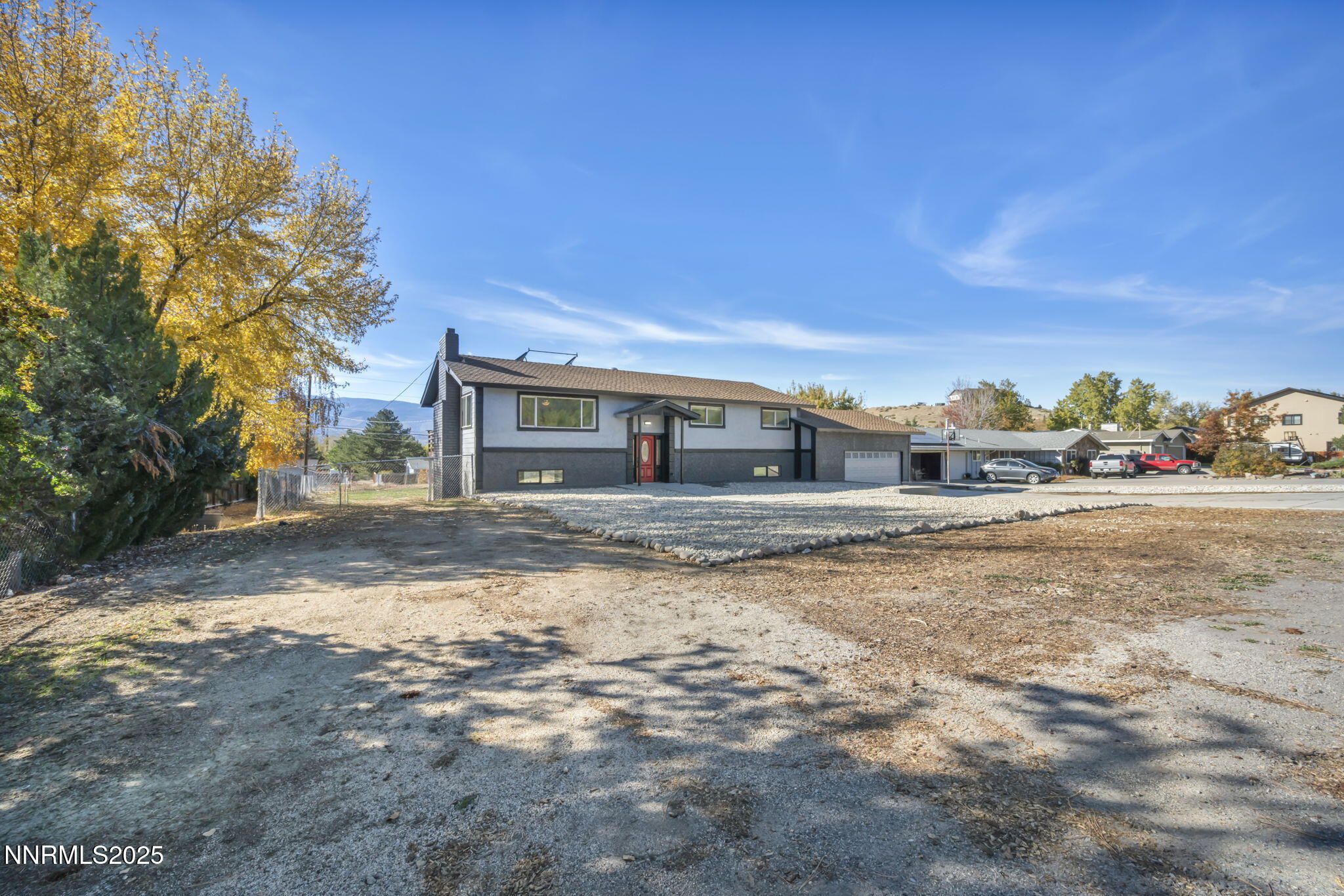 14595 Chamy Drive Reno, NV 89521 - Photo 66 of 66 a front view of a house with a yard and trees