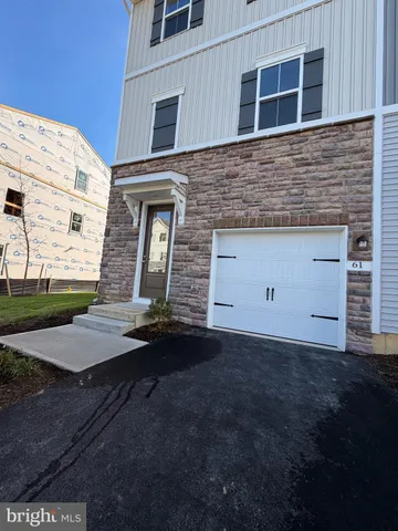 a front view of a house with garage