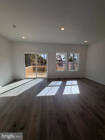 a view of empty room with windows