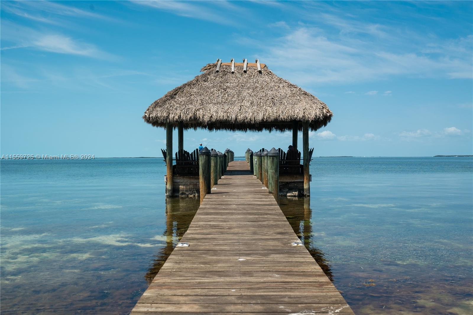 209 Sanctuary Dr., Unit 209 Key Largo, FL 33037 - Photo 1 of 43 a front view of a house with a yard