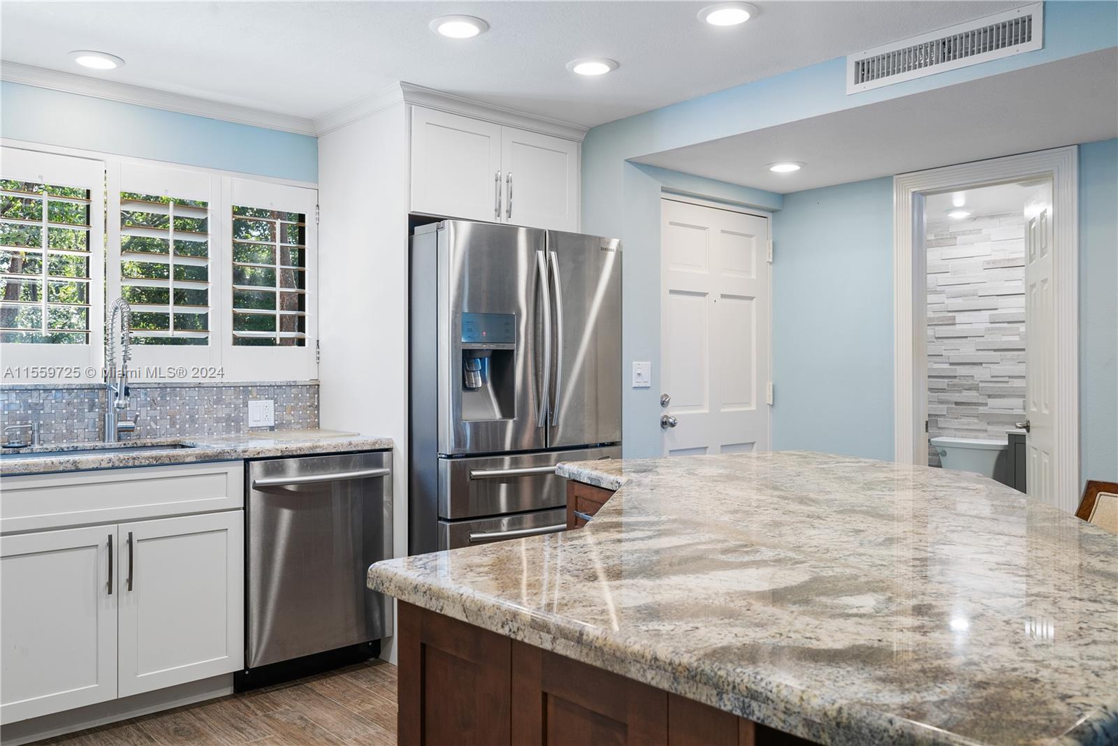 209 Sanctuary Dr., Unit 209 Key Largo, FL 33037 - Photo 12 of 43 a kitchen with stainless steel appliances granite countertop a sink stove and refrigerator