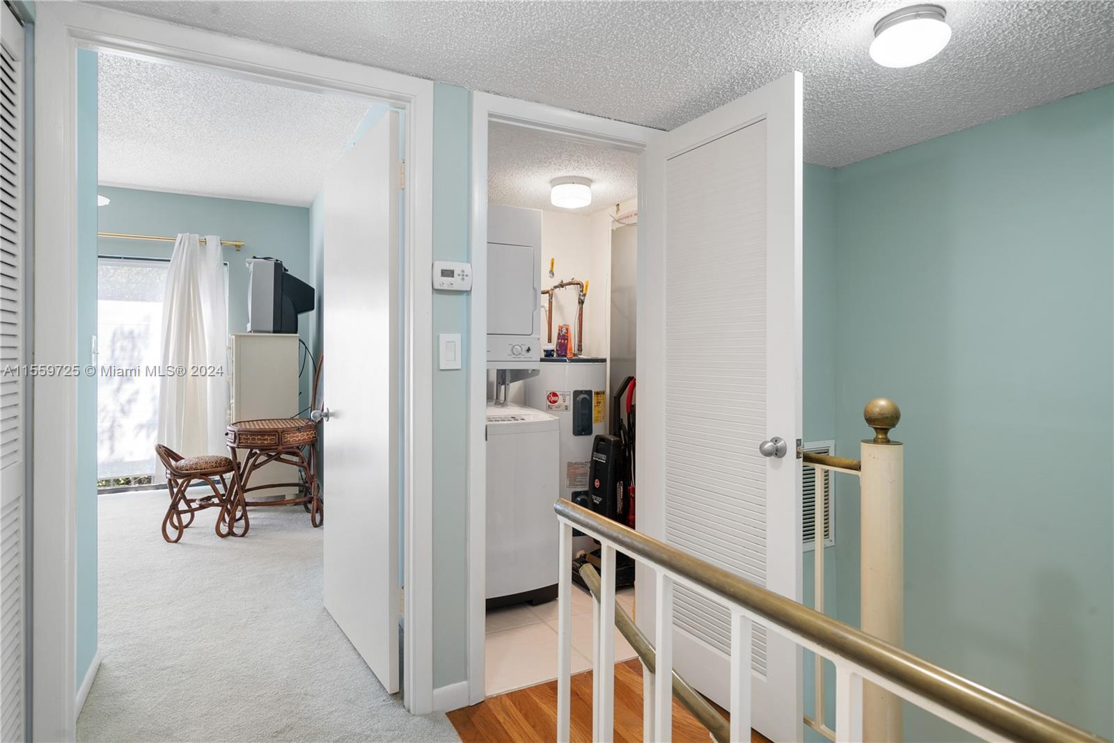 209 Sanctuary Dr., Unit 209 Key Largo, FL 33037 - Photo 14 of 43 a view of a hallway with furniture and floor to ceiling window
