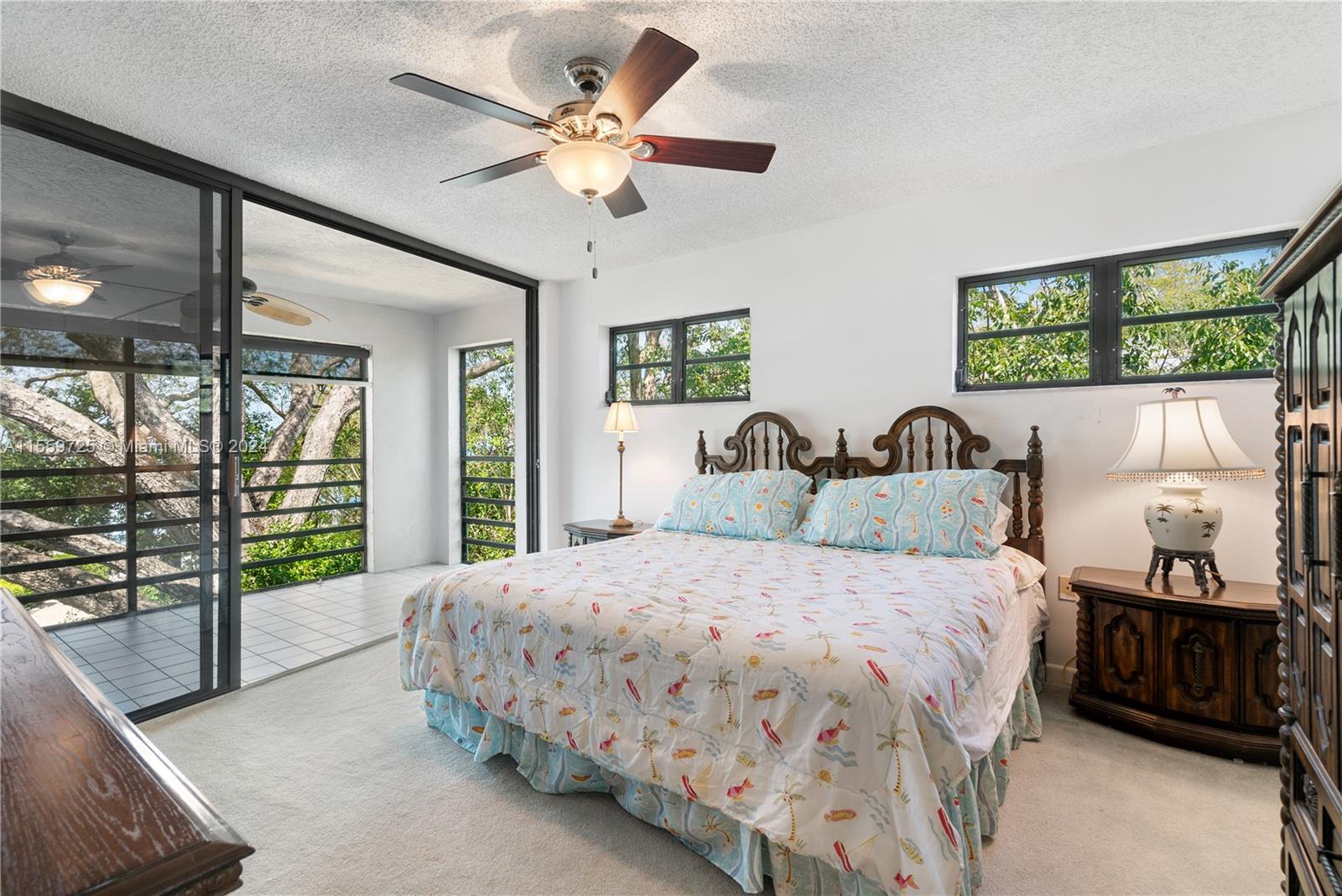 209 Sanctuary Dr., Unit 209 Key Largo, FL 33037 - Photo 17 of 43 a bedroom with a large bed and a large window