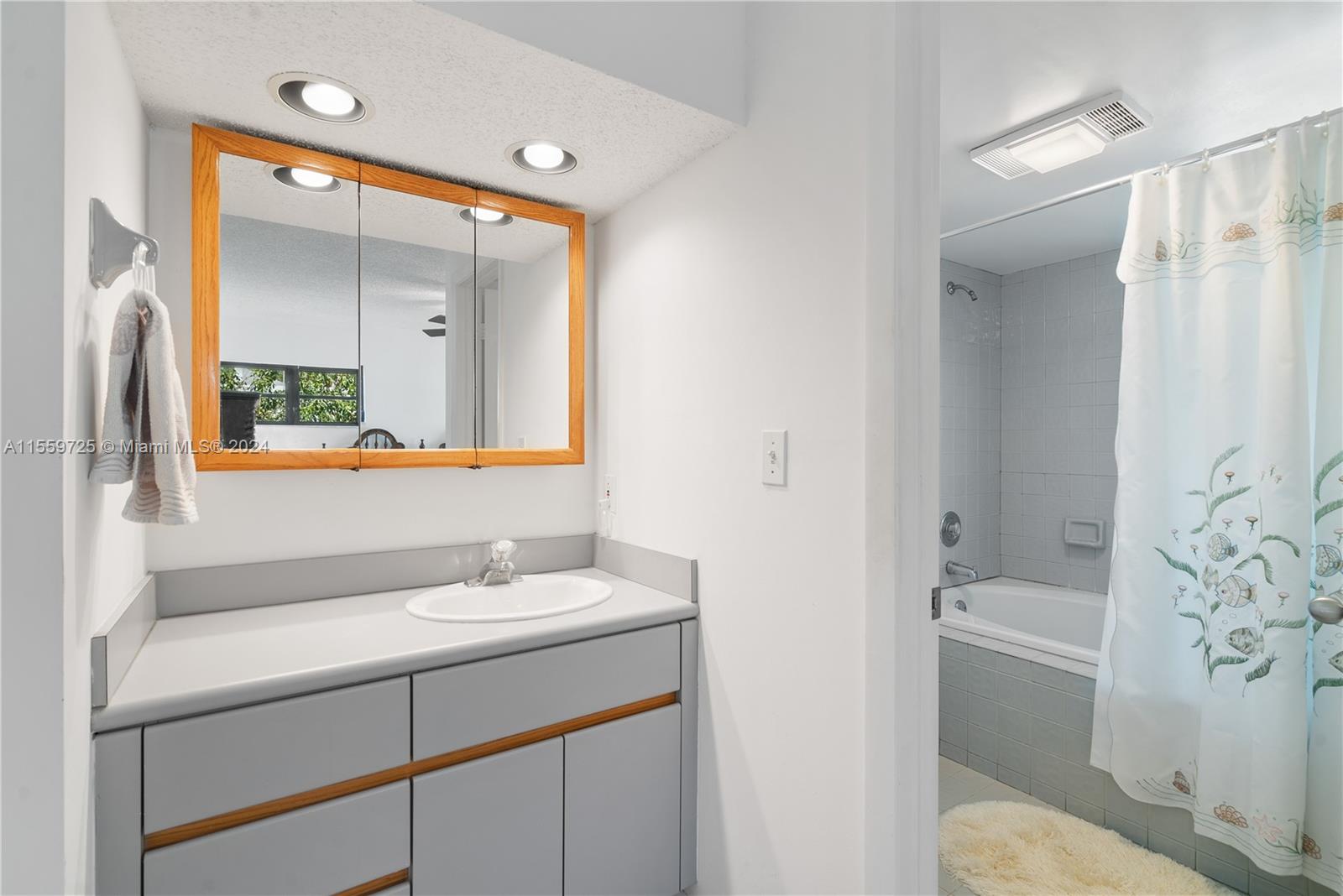 209 Sanctuary Dr., Unit 209 Key Largo, FL 33037 - Photo 20 of 43 a bathroom with a sink vanity toilet and shower