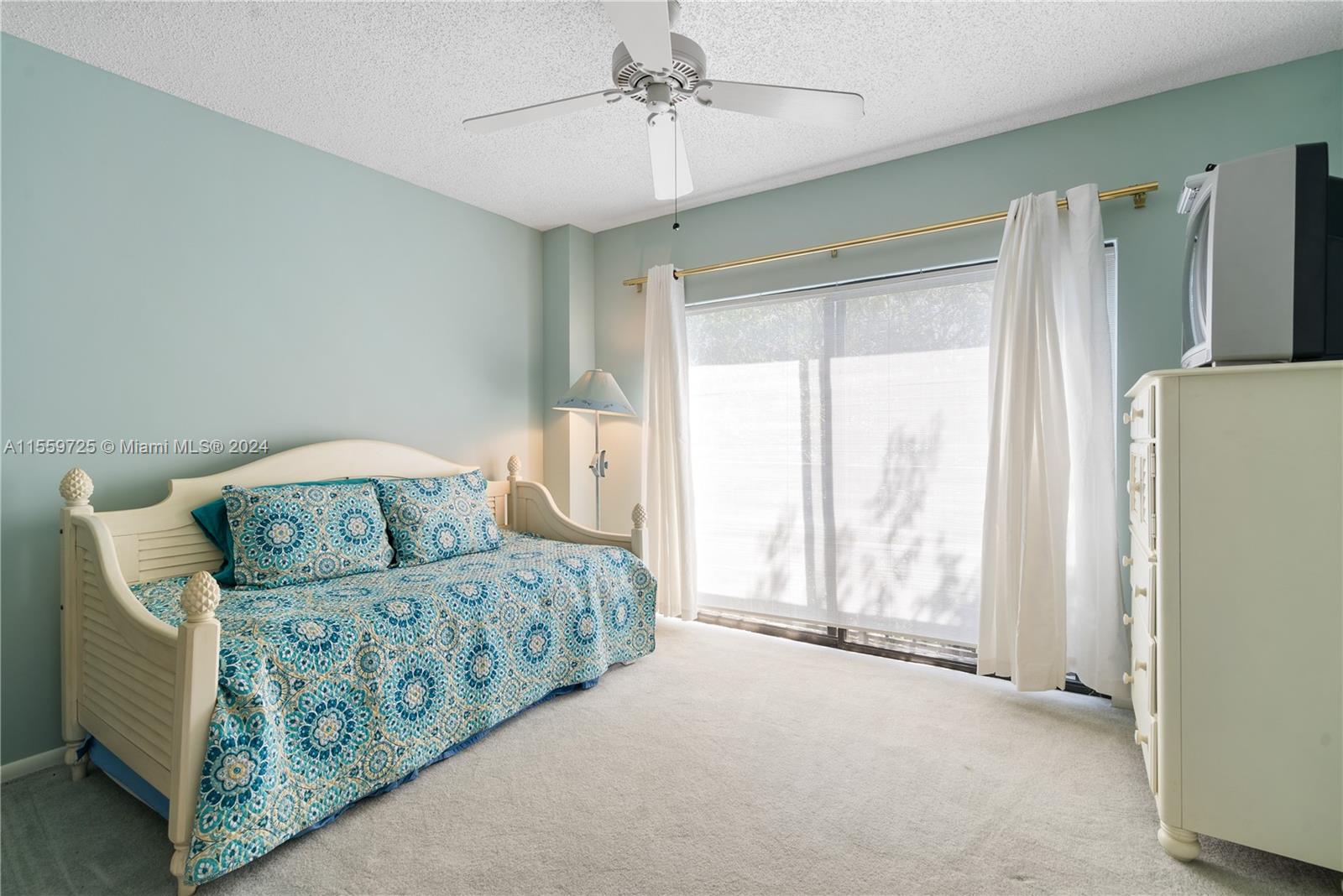 209 Sanctuary Dr., Unit 209 Key Largo, FL 33037 - Photo 25 of 43 a bedroom with furniture and a large window