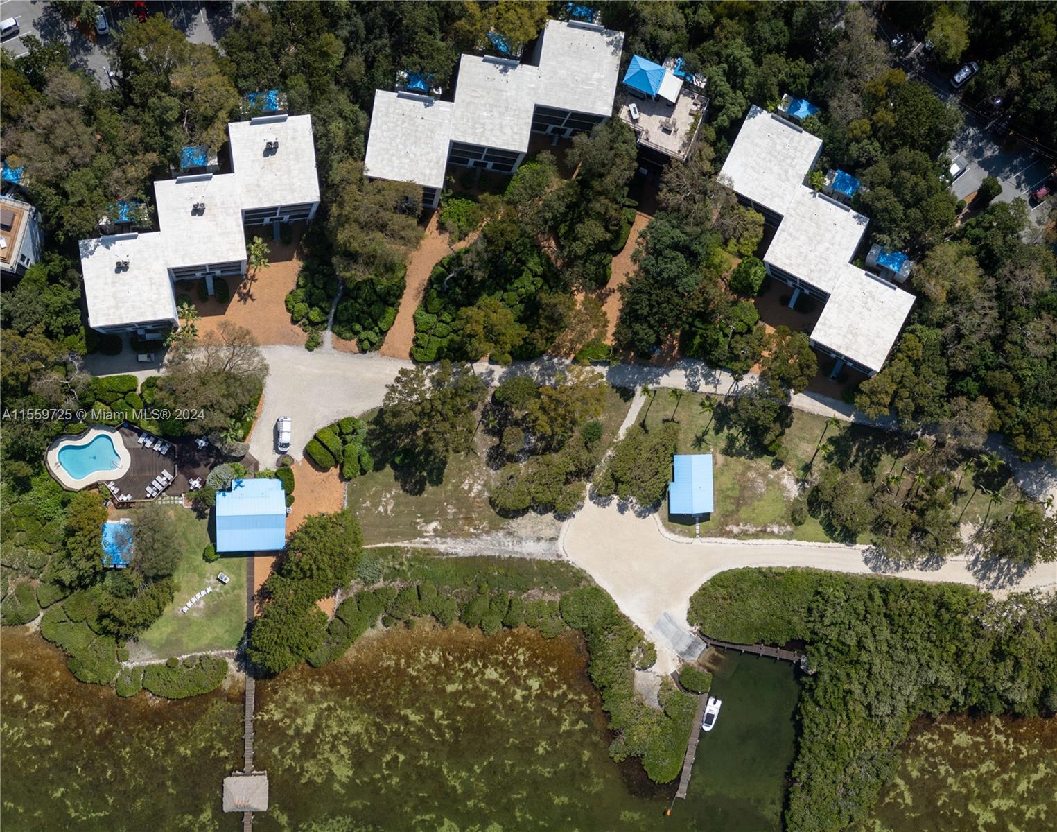 209 Sanctuary Dr., Unit 209 Key Largo, FL 33037 - Photo 32 of 43 an aerial view of residential house with outdoor space and parking