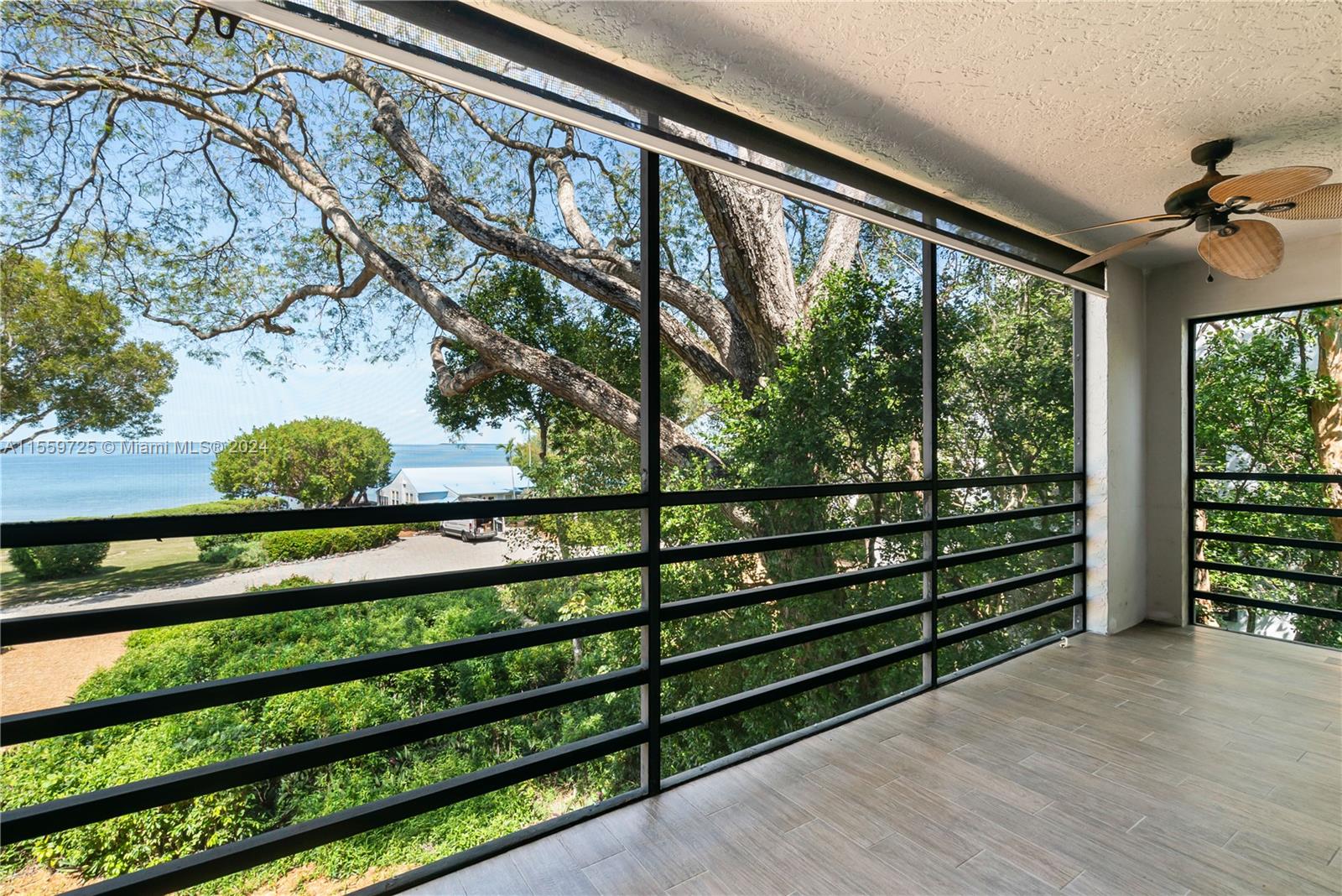 209 Sanctuary Dr., Unit 209 Key Largo, FL 33037 - Photo 4 of 43 a view of a wooden bench in a room