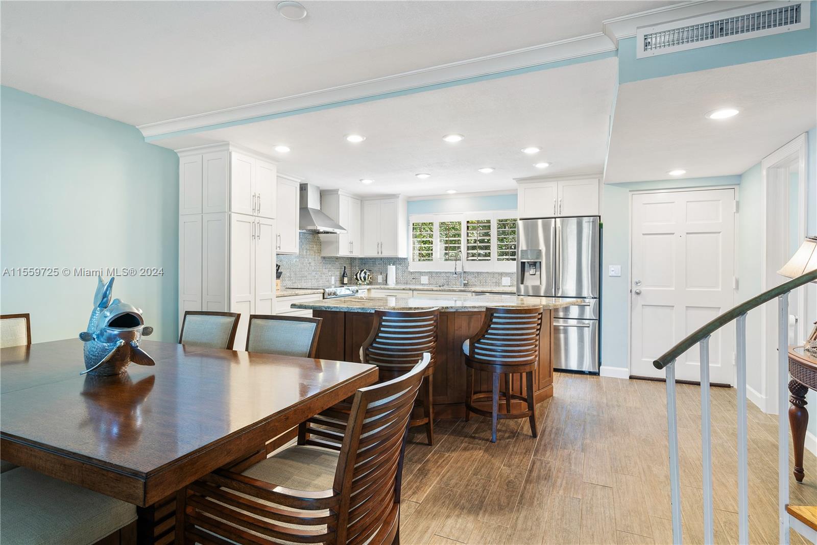 209 Sanctuary Dr., Unit 209 Key Largo, FL 33037 - Photo 9 of 43 a kitchen with a dining table chairs and view living room