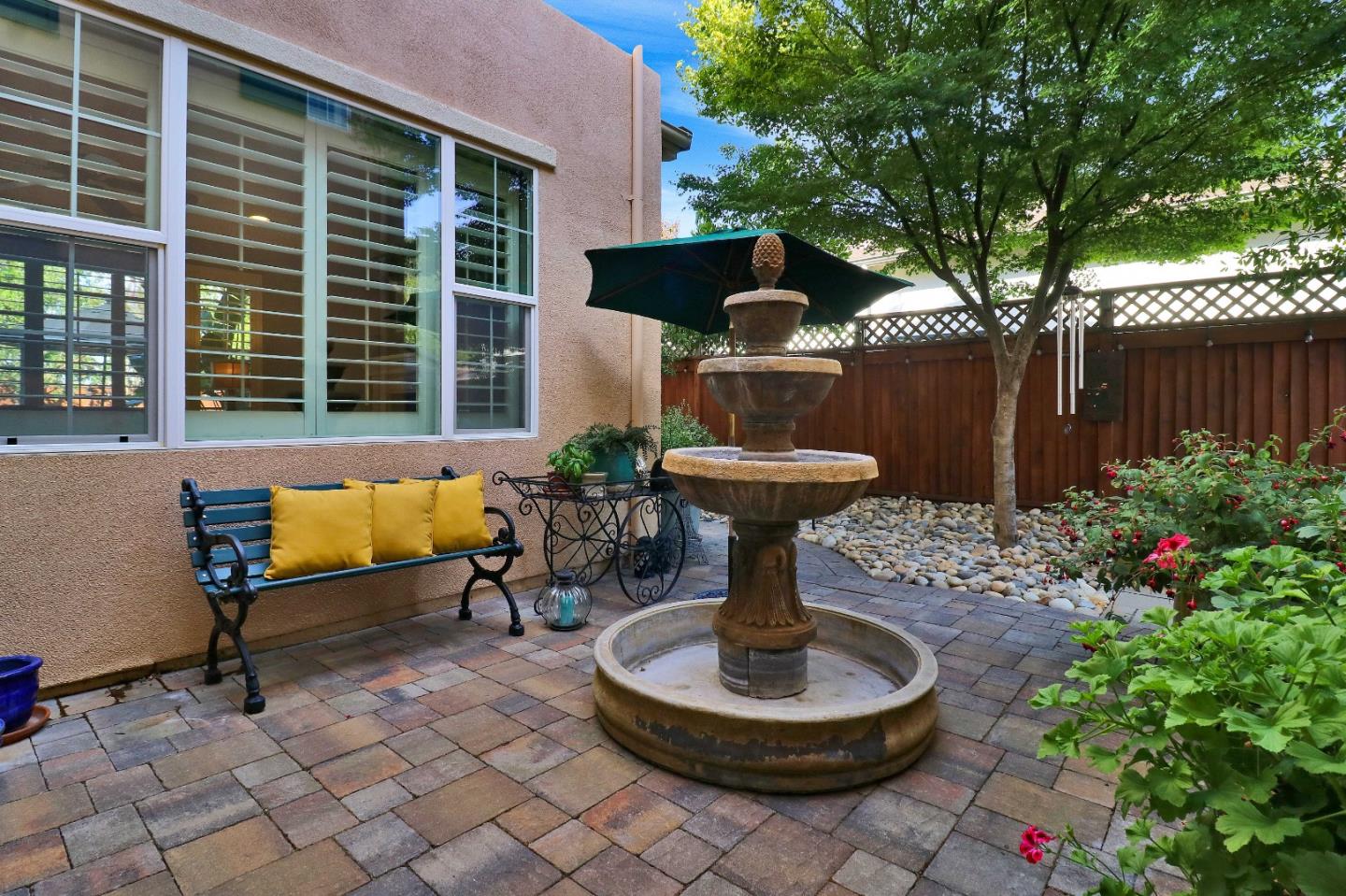 7120 Eagle Ridge Drive Gilroy, CA 95020 - Photo 21 of 21 a view of a chair and table in back yard of the house