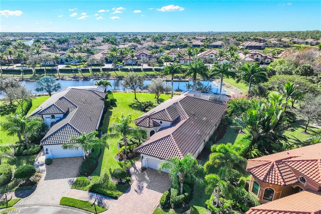 6502 Roma Way Naples, FL 34113 - Photo 3 of 43 an aerial view of residential houses with outdoor space and lake view