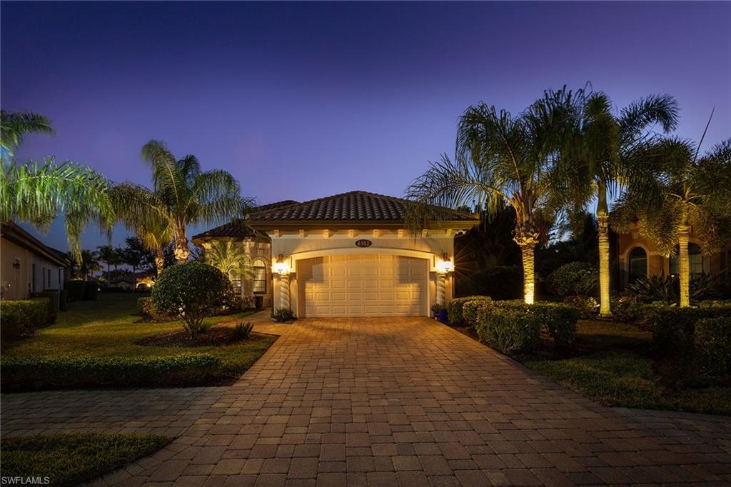 6502 Roma Way Naples, FL 34113 - Photo 32 of 43 a view of a house with a yard