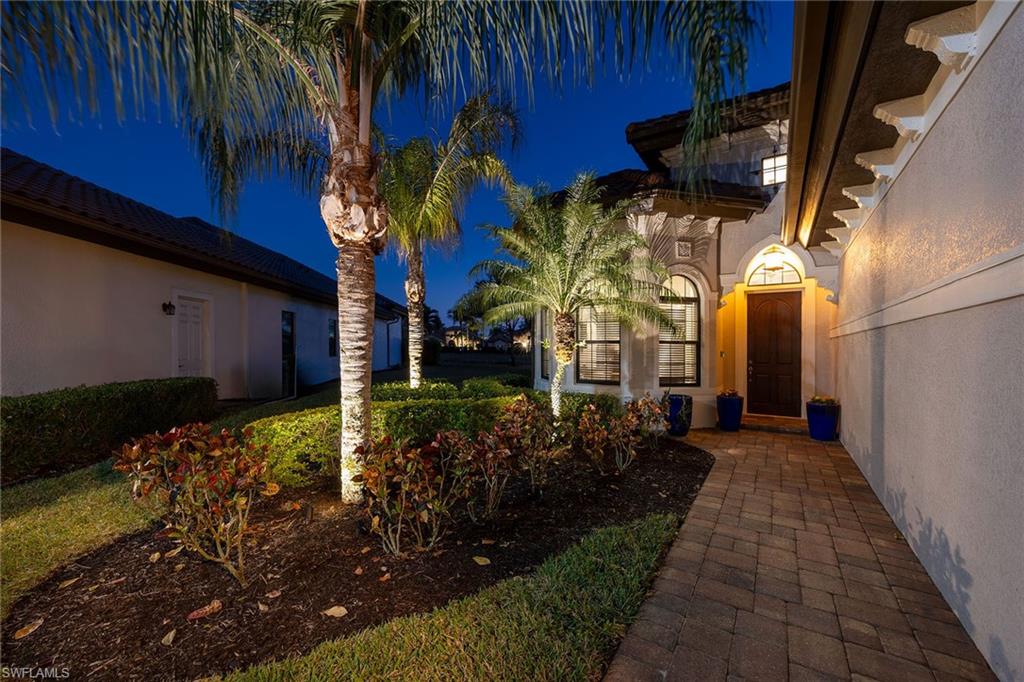 6502 Roma Way Naples, FL 34113 - Photo 33 of 43 a view of a house with a yard