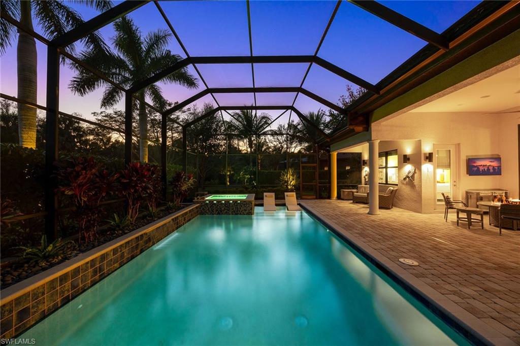 6502 Roma Way Naples, FL 34113 - Photo 34 of 43 a view of swimming pool with a patio