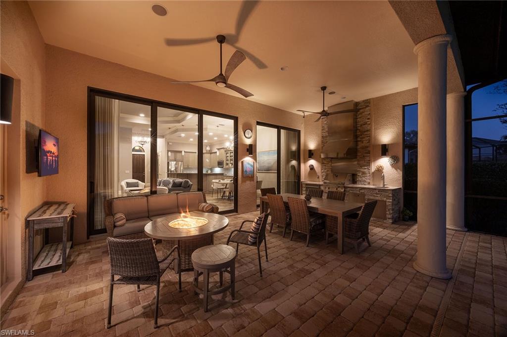 6502 Roma Way Naples, FL 34113 - Photo 36 of 43 a view of a dining room with furniture window and outside view