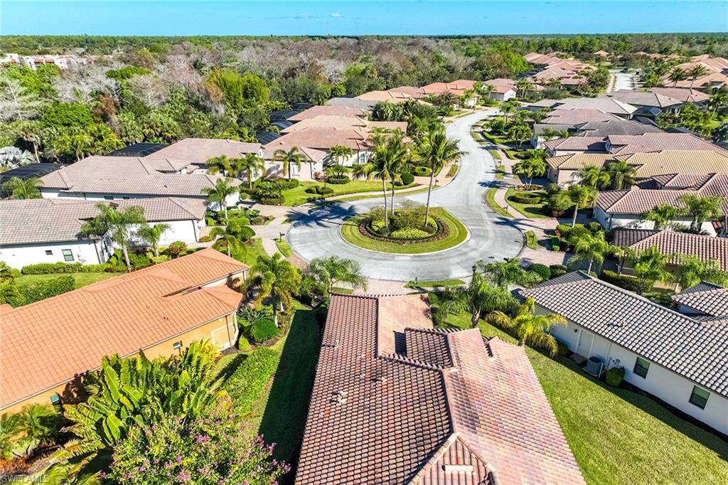 6502 Roma Way Naples, FL 34113 - Photo 6 of 43 an aerial view of a house with a swimming pool