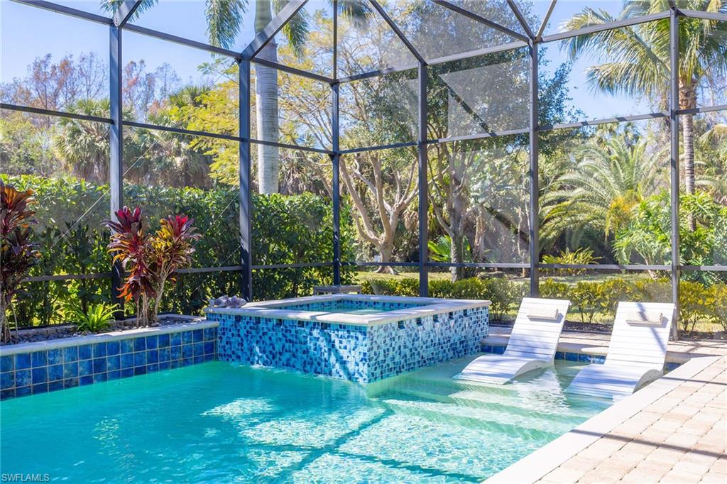 6502 Roma Way Naples, FL 34113 - Photo 8 of 43 a view of yard with a bench in center