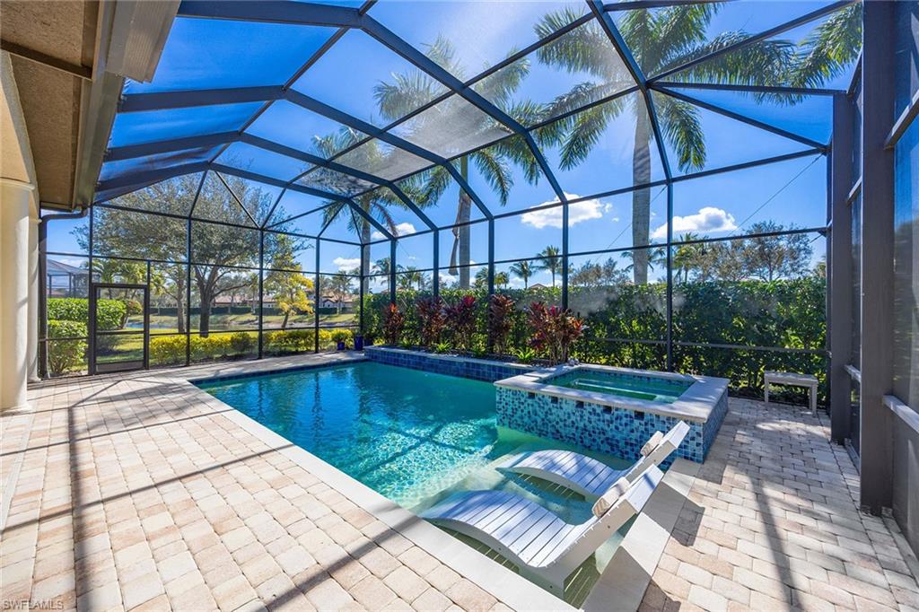 6502 Roma Way Naples, FL 34113 - Photo 10 of 43 a view of swimming pool with a patio