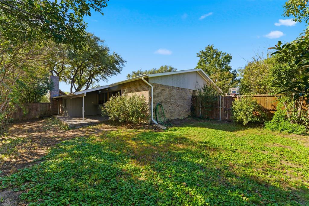 1805 Haymeadow Carrollton, TX 75007 - Photo 15 of 20 a view of a house with a yard and large tree