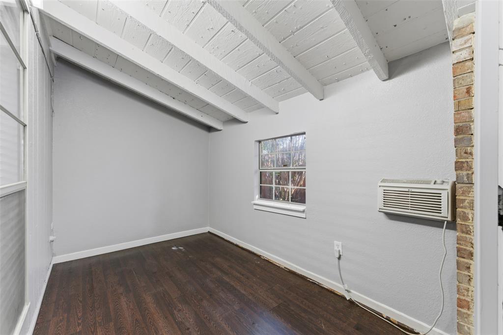 1805 Haymeadow Carrollton, TX 75007 - Photo 4 of 20 a view of a room with wooden floor and windows