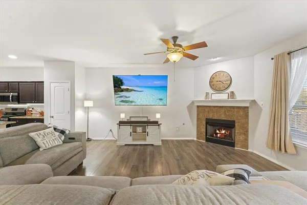 a view of a dining room with furniture window and wooden floor