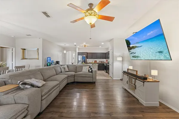 a dining room with furniture a chandelier and window