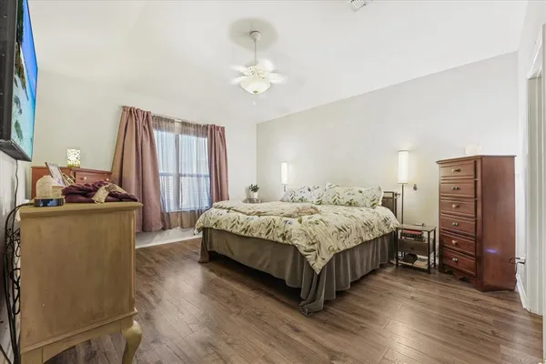 a bedroom with a bed and hallway