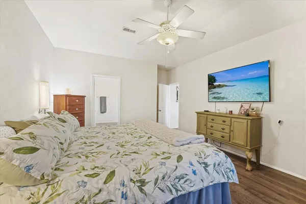 a bedroom with a bed and a dresser