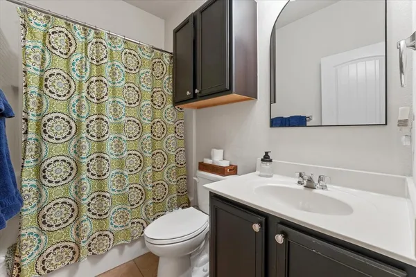 a bathroom with a double vanity sink and mirror