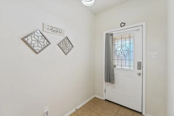a view of an entryway with wooden floor