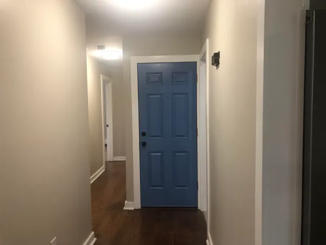 an empty room with wooden floor