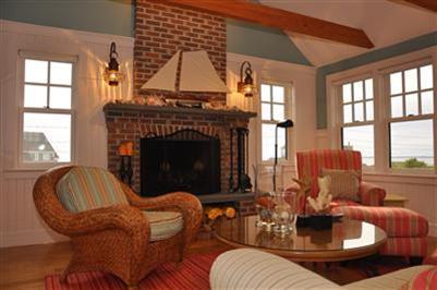 9 Twinefield Road Truro, MA 02666 - Photo 7 of 15 a living room with furniture a fireplace and large windows