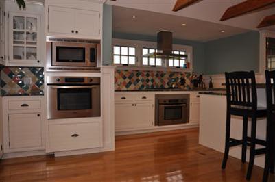 9 Twinefield Road Truro, MA 02666 - Photo 9 of 15 a kitchen with granite countertop a stove and a microwave
