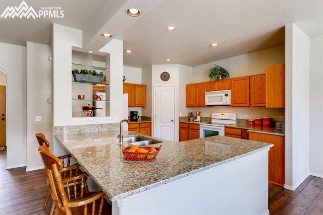 1944 Coldstone Way Colorado Springs, CO 80921 - Photo 6 of 23 Granite counters and updated faucets!