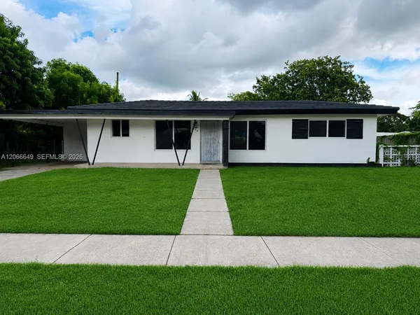 a view of a backyard of the house