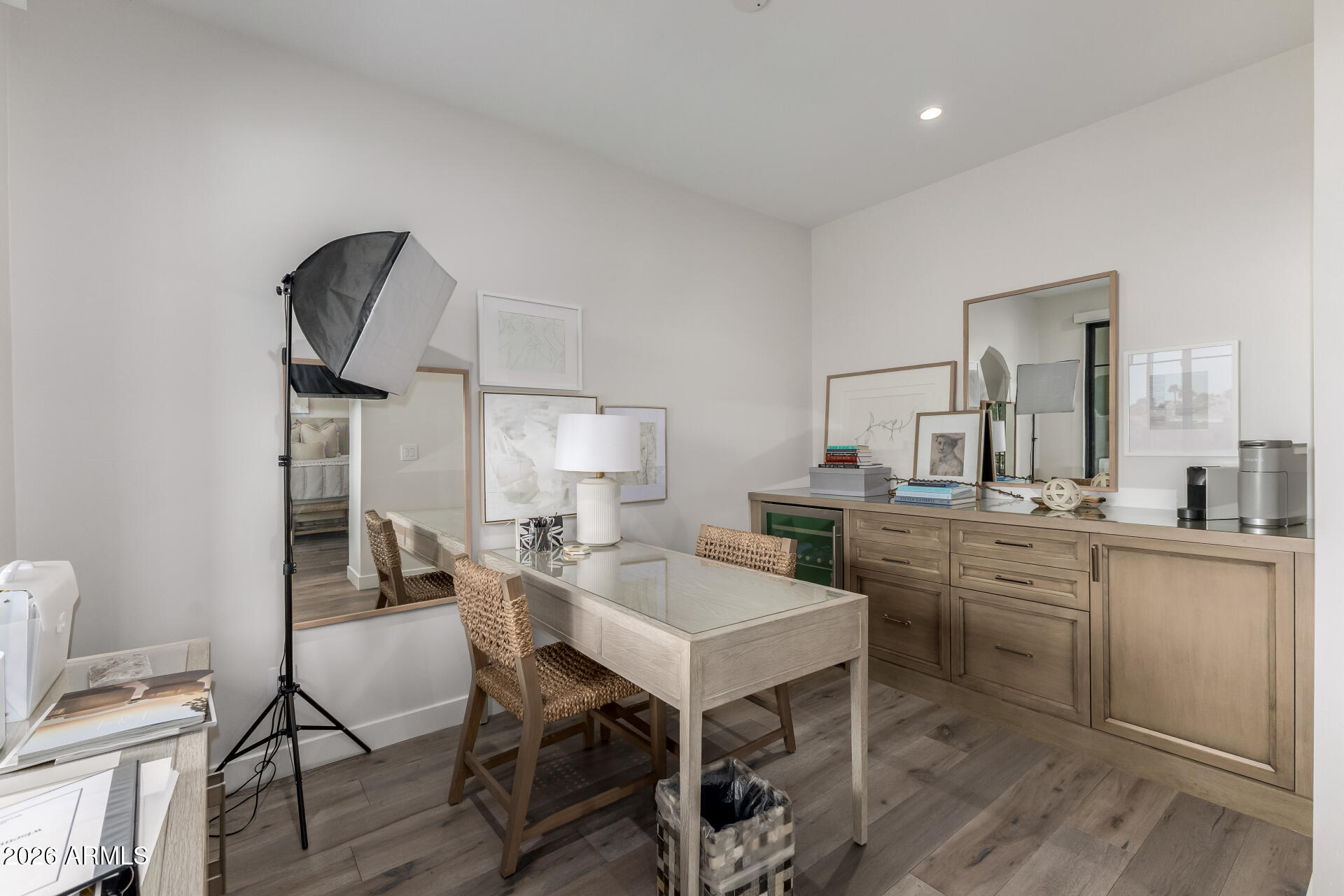 6500 East Camelback Road, Unit 1010 Scottsdale, AZ 85251 - Photo 12 of 24 a kitchen with a table chairs sink and cabinets