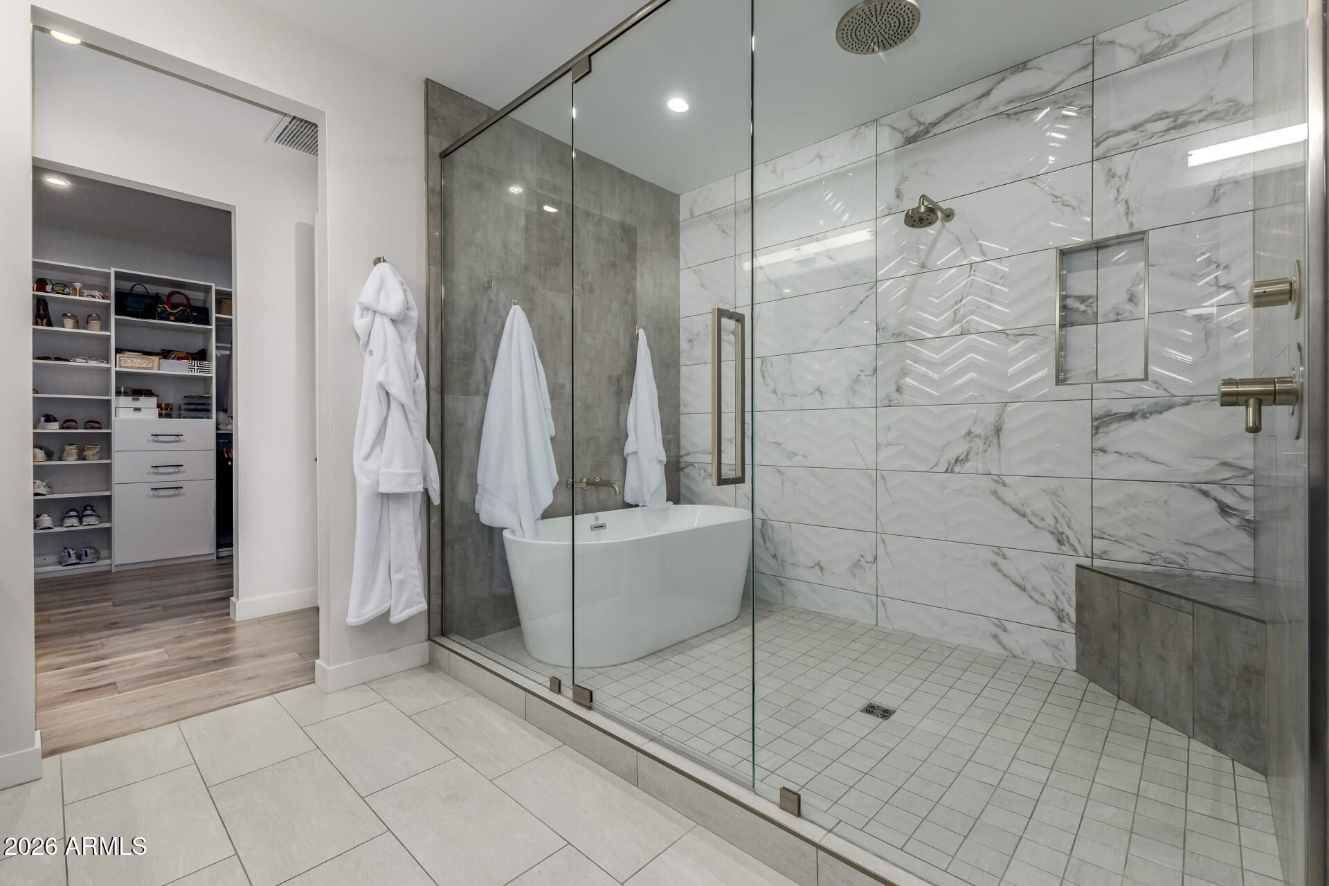 6500 East Camelback Road, Unit 1010 Scottsdale, AZ 85251 - Photo 14 of 24 a bathroom with a shower and a bathtub