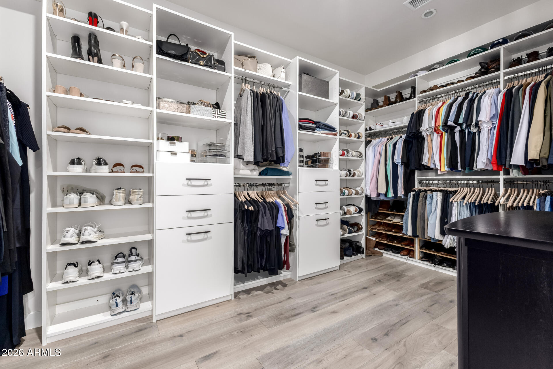 6500 East Camelback Road, Unit 1010 Scottsdale, AZ 85251 - Photo 15 of 24 a view of walk in closet with clothes and shoes