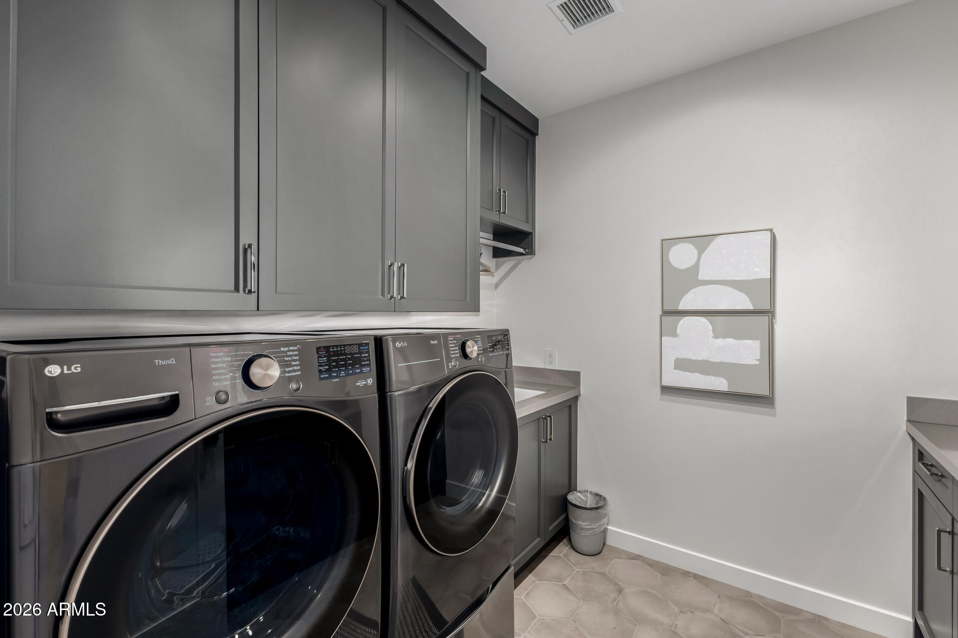6500 East Camelback Road, Unit 1010 Scottsdale, AZ 85251 - Photo 18 of 24 a utility room with dryer and washer