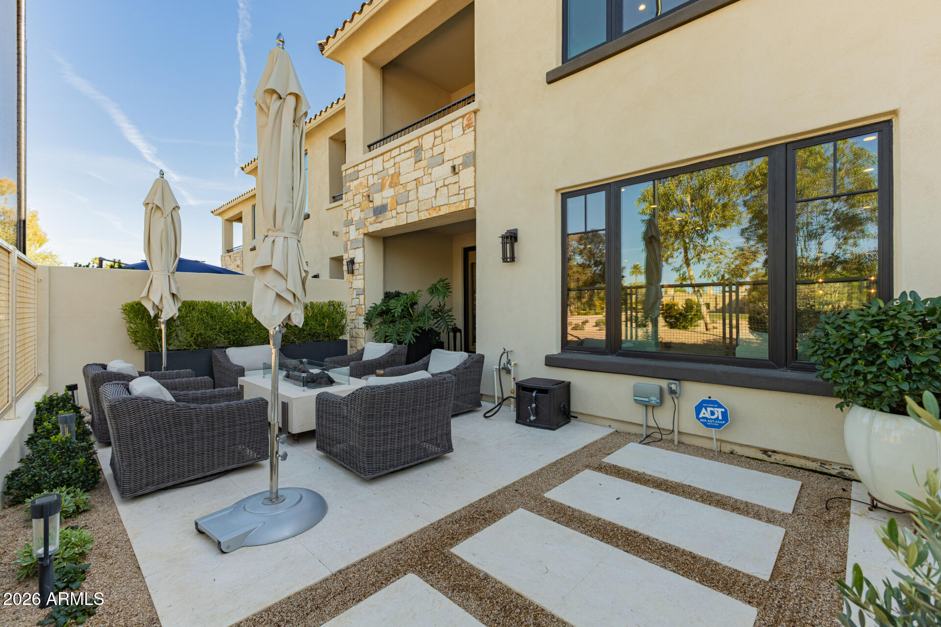 6500 East Camelback Road, Unit 1010 Scottsdale, AZ 85251 - Photo 20 of 24 a living room with furniture windows and a table