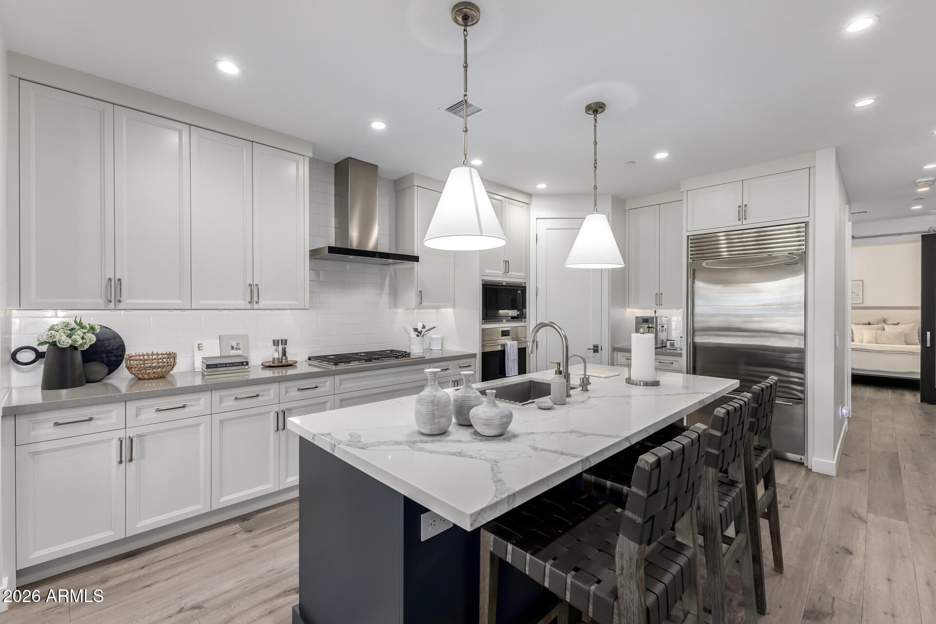 6500 East Camelback Road, Unit 1010 Scottsdale, AZ 85251 - Photo 7 of 24 a kitchen with stainless steel appliances granite countertop a sink a stove a refrigerator and island