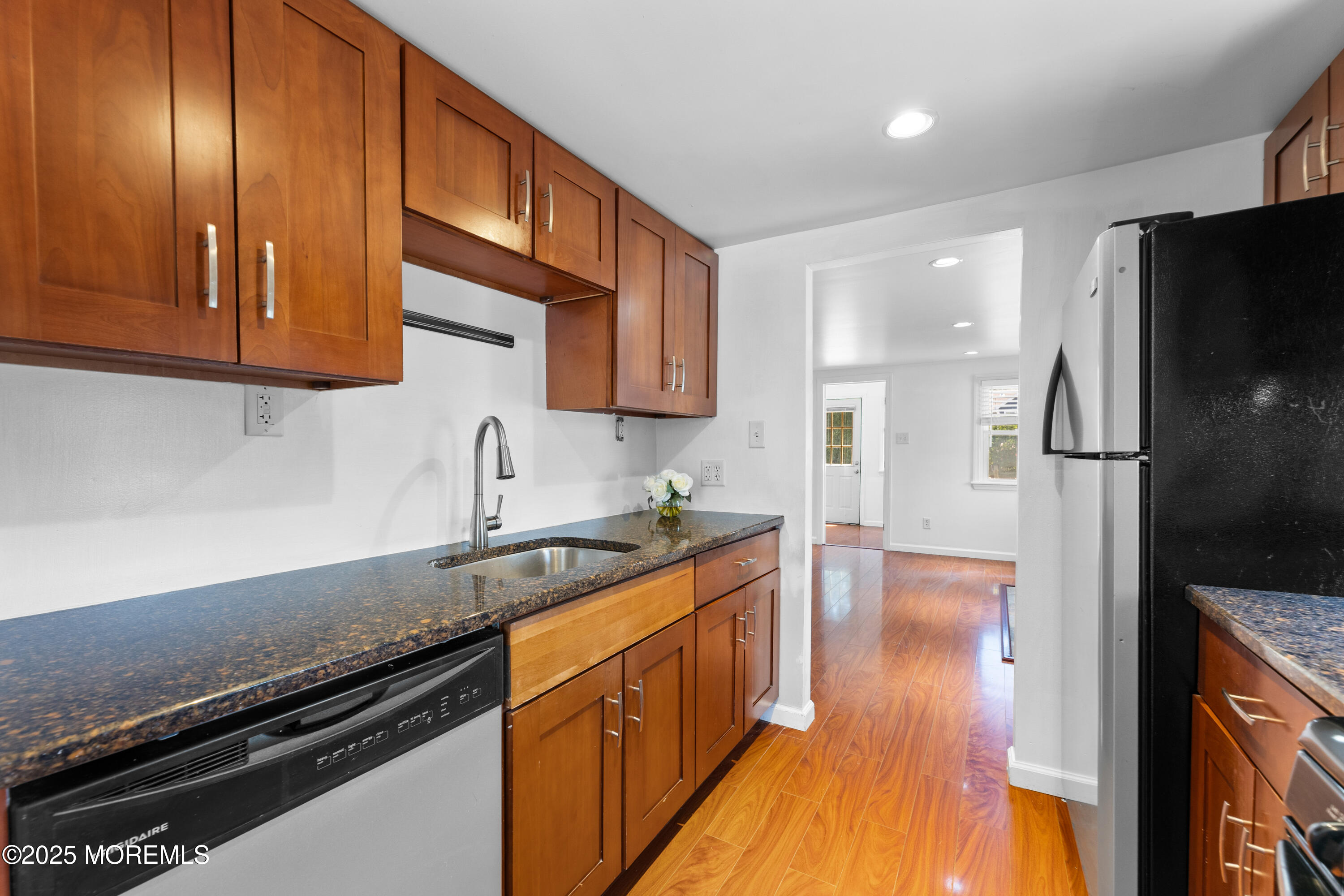 474 Burnt Bark Road Brick, NJ 08723 - Photo 11 of 28 a kitchen with granite countertop stainless steel appliances a sink stove top oven and refrigerator