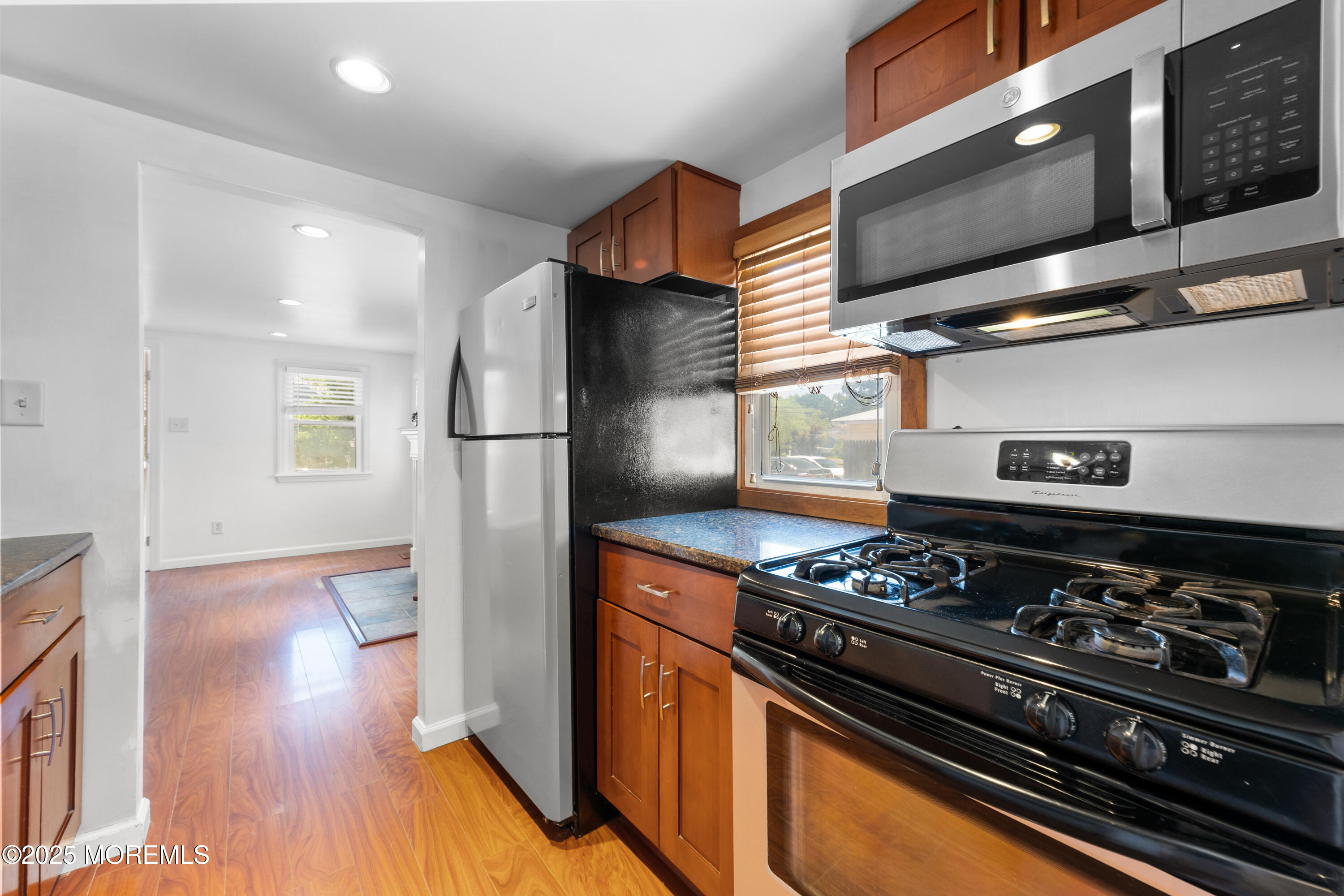 474 Burnt Bark Road Brick, NJ 08723 - Photo 12 of 28 a kitchen with stainless steel appliances granite countertop a stove and a refrigerator