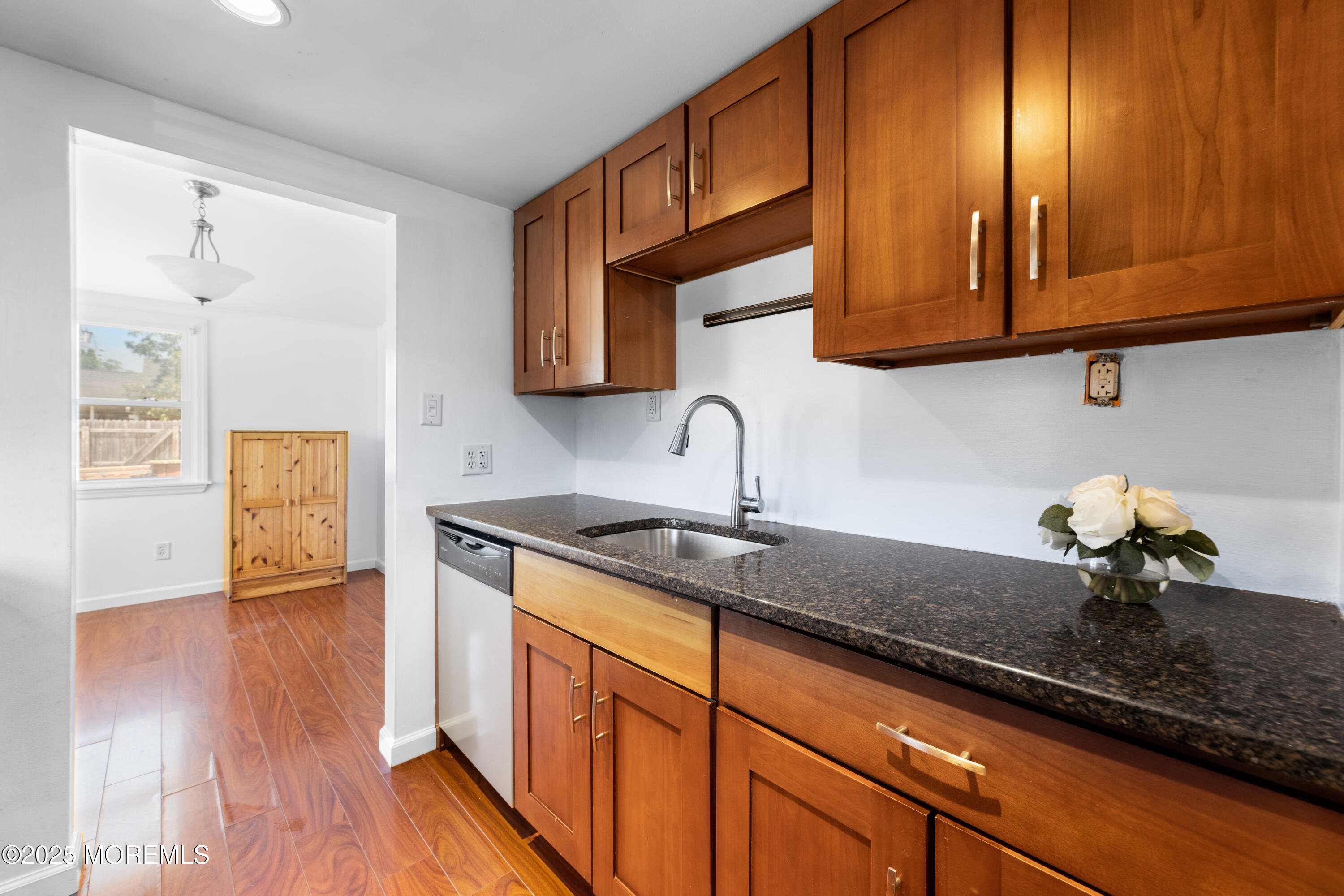 474 Burnt Bark Road Brick, NJ 08723 - Photo 13 of 28 a kitchen with stainless steel appliances granite countertop wooden cabinets a sink and dishwasher